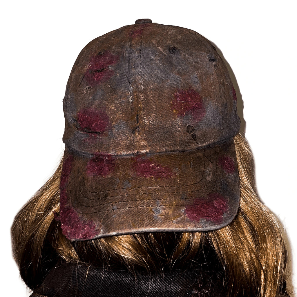 SELF-DECAY DISTRESSED CAP